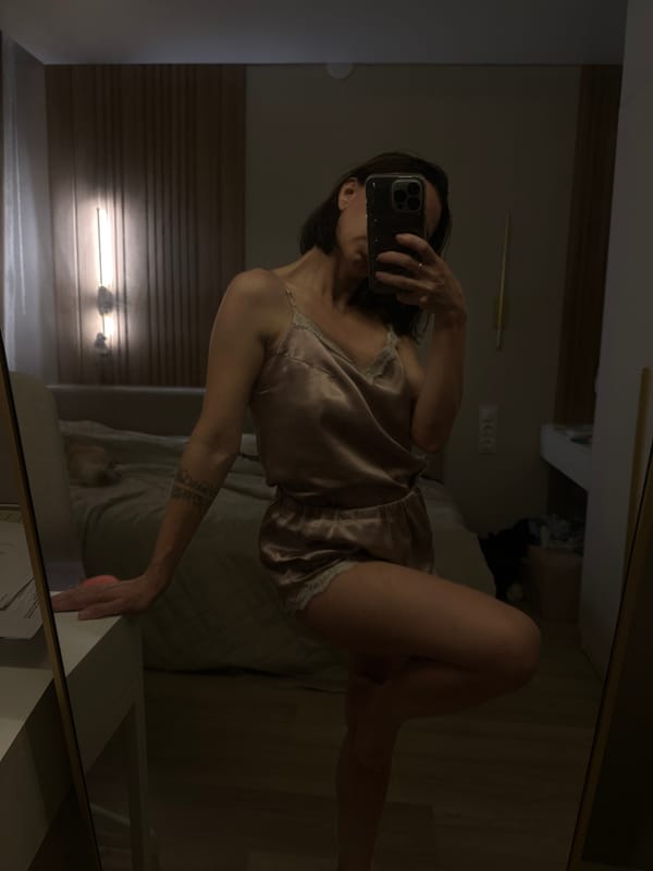 Mirror selfie session in a Votkinsk bedroom, multiple poses