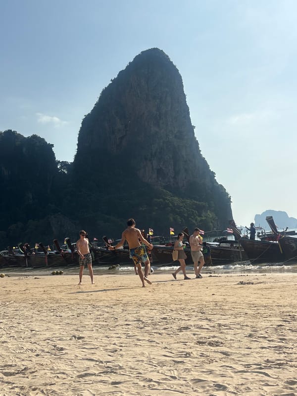 Men play beach soccer in Ban Ao Nang Thailand