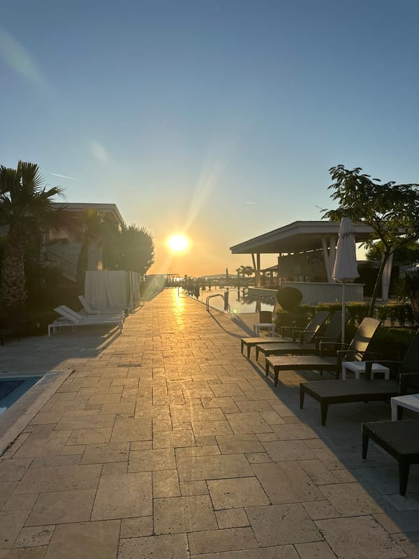 Sunset at a Sozopol resort pool and courtyard