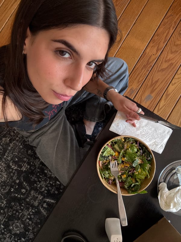 Woman dines on salad in Mexico City evening