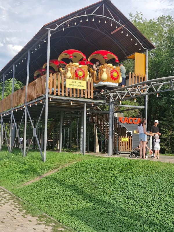 Park life along Astana's canals: swans, rides, and greenery