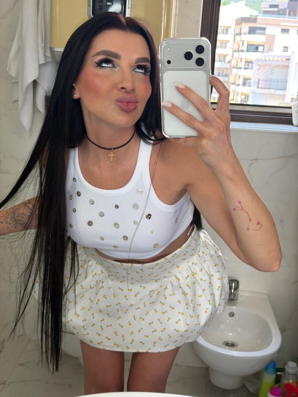 Woman takes selfies in white and floral outfit, Montenegro