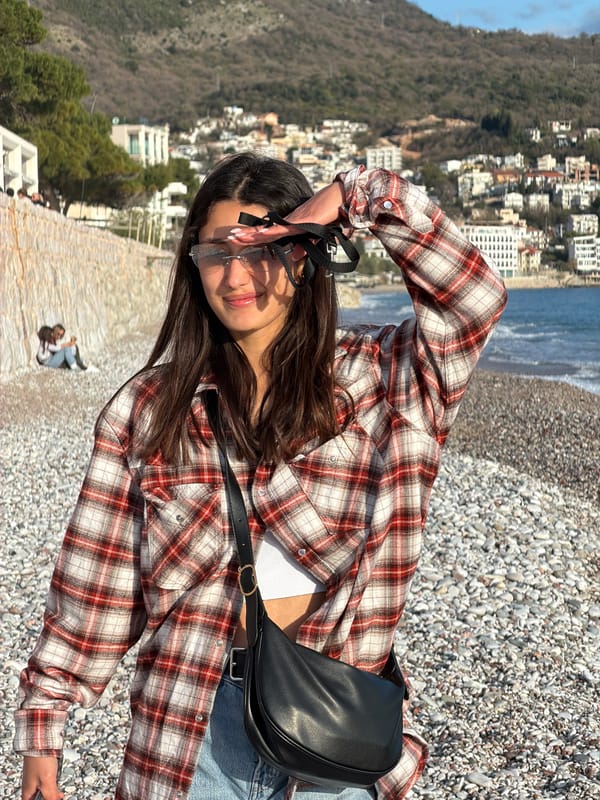Woman with small dog enjoys sunny afternoon at Montenegro cafe