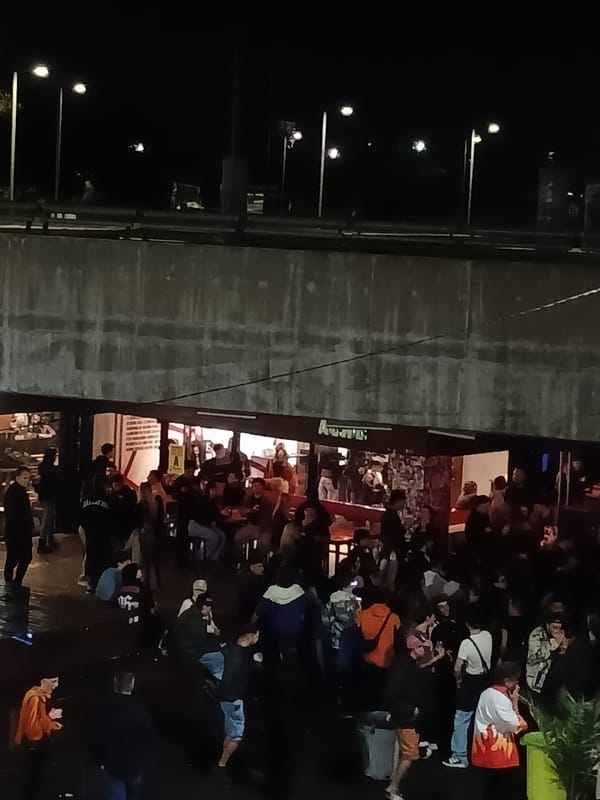 Late-night social gathering documented in Buenos Aires Puerto Madero district