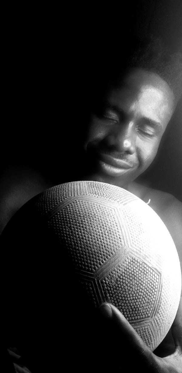 Man photographed with soccer ball in nighttime Narayi session