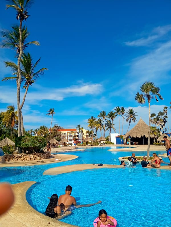 Resort guests enjoy evening swim at Playa El Agua