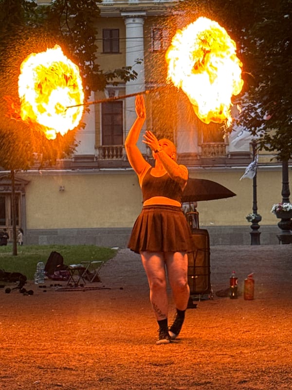 Fire performers light up a Saint Petersburg square on a summer evening