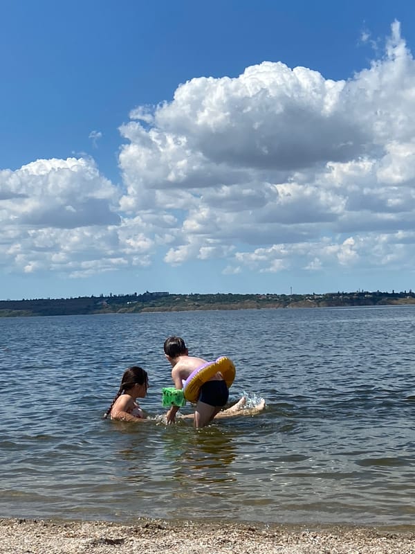 A lively summer swim session at a calm shoreline.