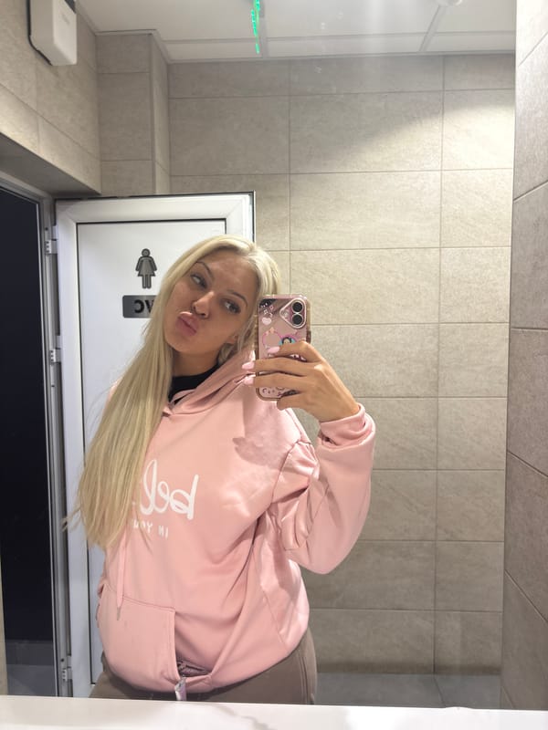 Woman takes bathroom selfies in Lozen, Bulgaria