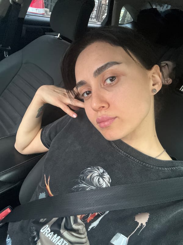 Woman takes car selfies in Tbilisi