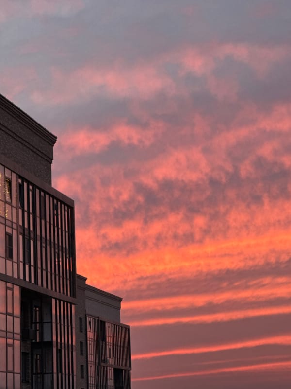 Smoke plume rises over Krasnoyarsk during dramatic sunset
