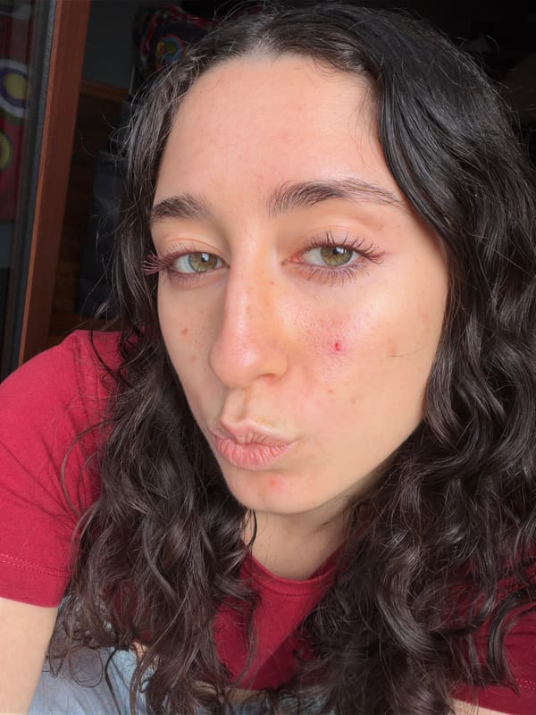 Young woman observed making pouty expression in Lissone, Italy
