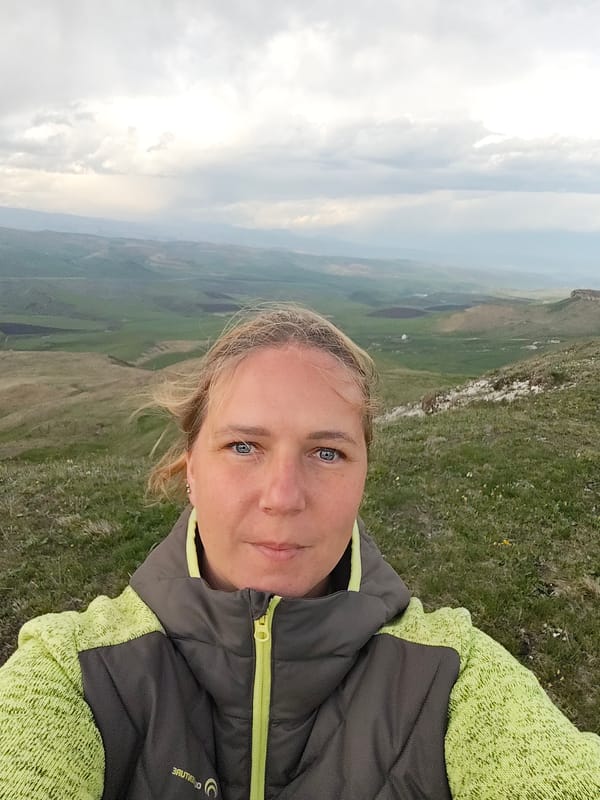Woman documents camping trip with dog in Russian hills
