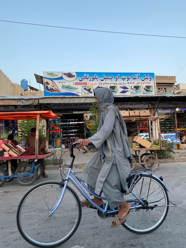 Street-level commerce and movement in Kandahar's marketplace