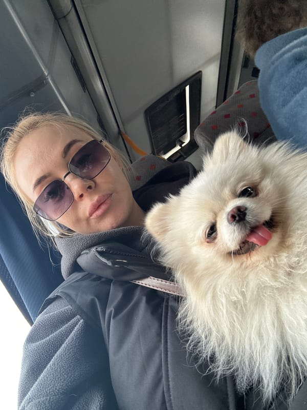 Woman takes selfies with dog on public transport in Russia