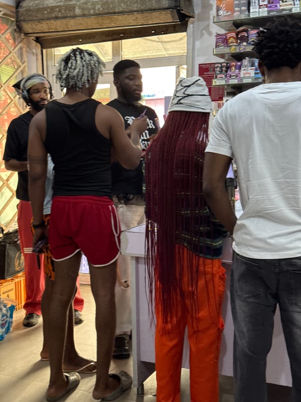 Daily commerce unfolds on Ado street vendors and shops