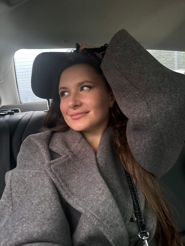 Woman in vehicle, plane overhead captured in Odintsovo