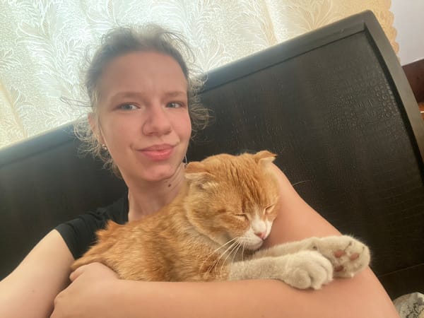 Woman photographs intimate moments with orange tabby cat in Ukraine