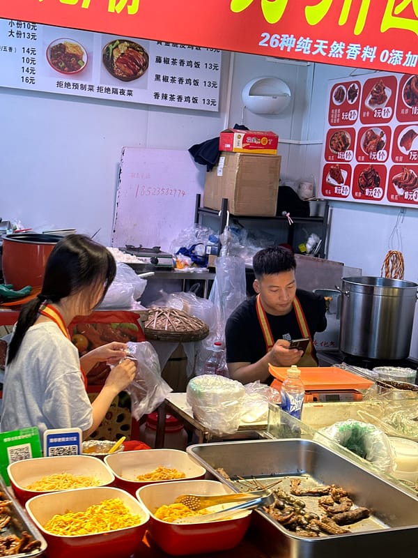 Street food vendors serve customers in Jiangjin District