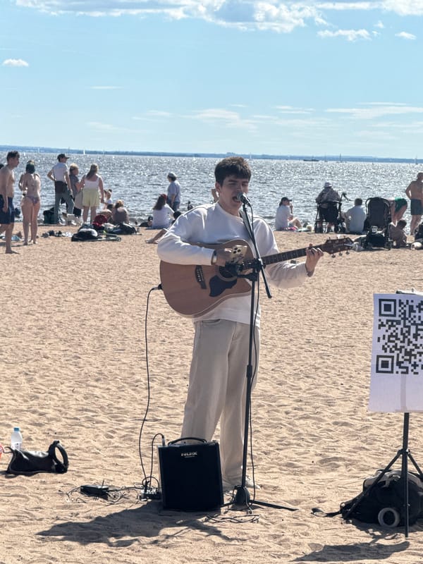 Busy beach day in Saint Petersburg with live music and fountains