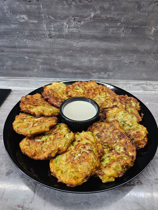 Homemade zucchini fritters and fresh cherries documented in Bulgaria