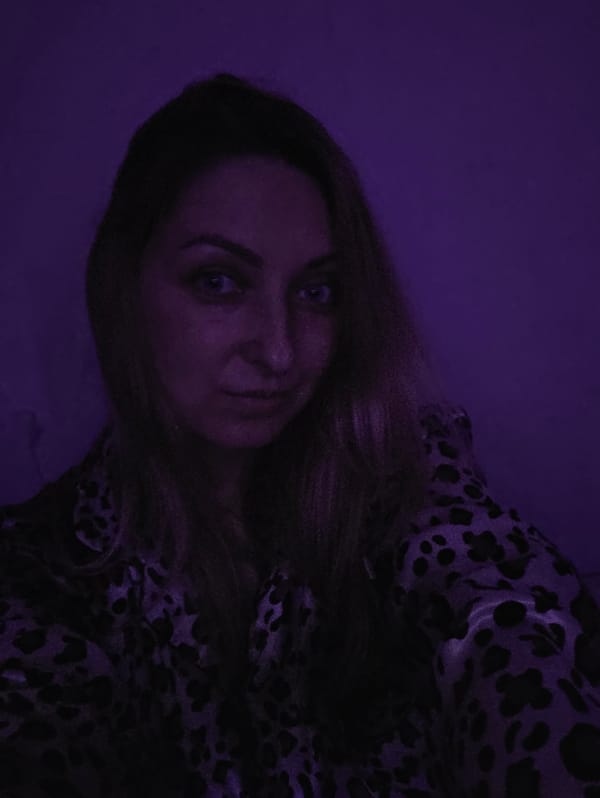 Personal photo session captured in purple-lit Minsk room