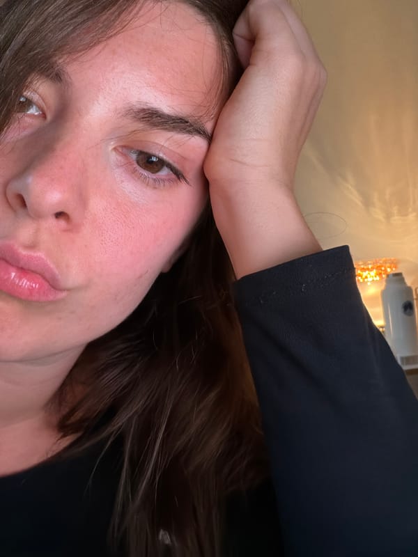 Woman photographed in contemplative pose indoors in Buenos Aires