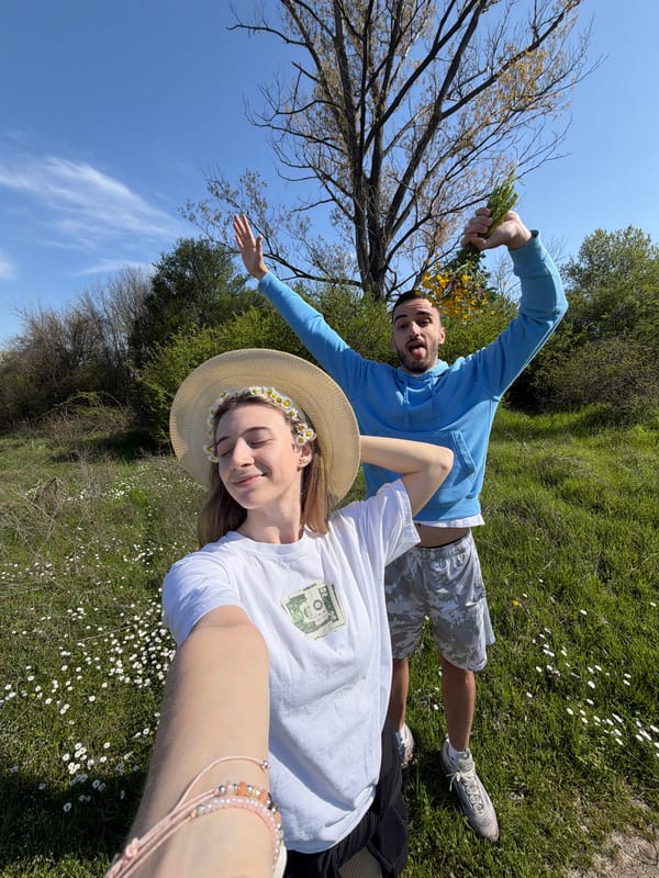 Couple photographed in Bulgarian daisy field during spring afternoon