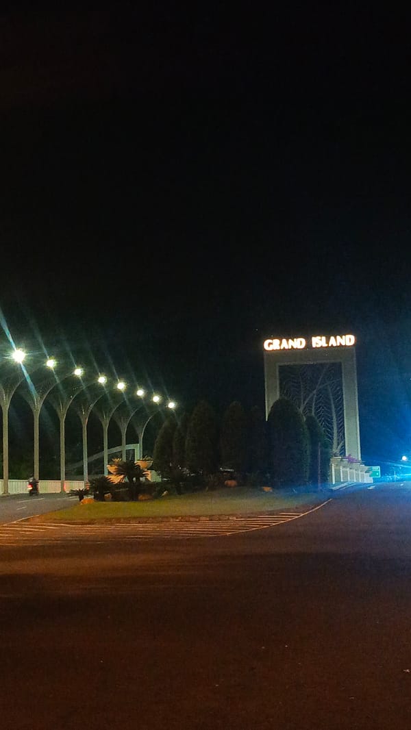 Grand Island entrance captured at night in Surabaya