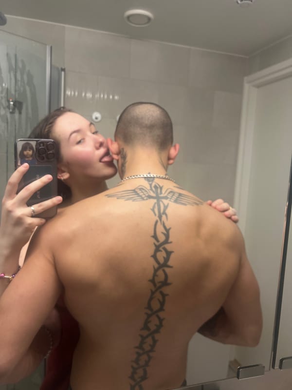 Couple Takes Multiple Mirror Selfies in Vantaa Bathroom