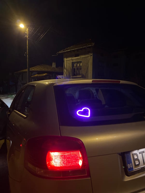 Evening scenes in Mindia: kitten in basket, car with neon heart