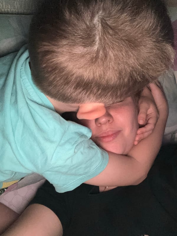 Mother and child share quiet moment in Rusanovo