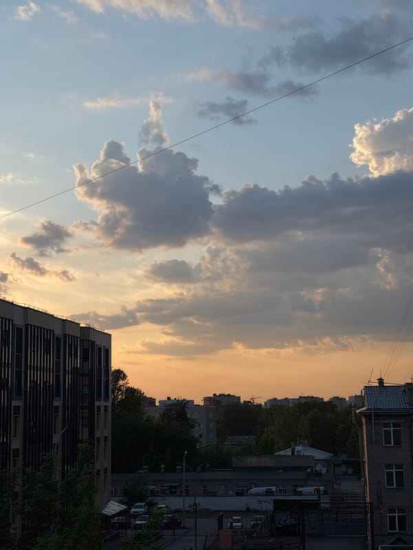 Aircraft observed flying over Perm cityscape at dusk