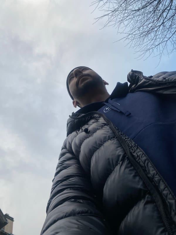 Man in winter clothing photographed from low angle
