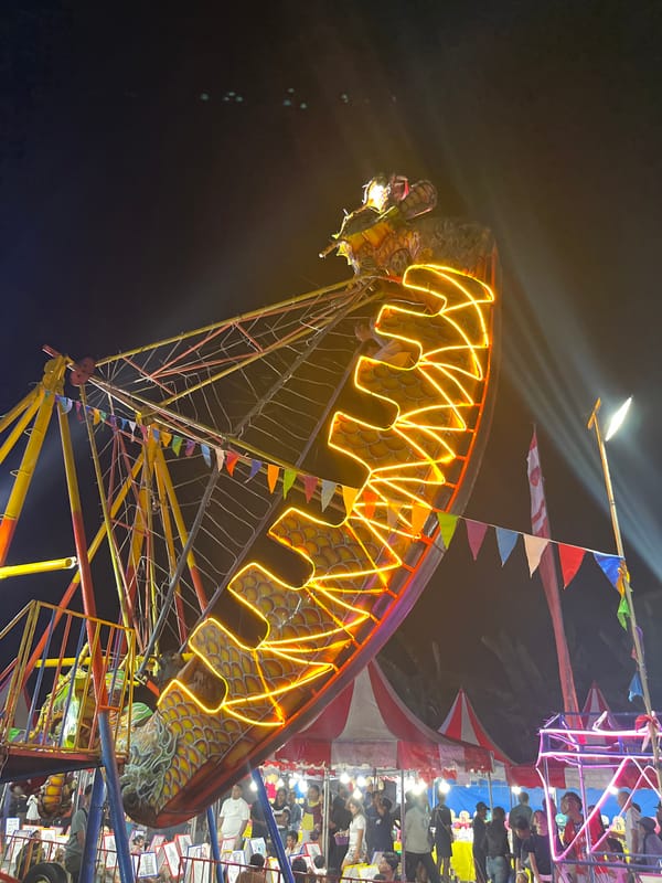 Neon-lit carnival night in Kuta Selatan, Bali