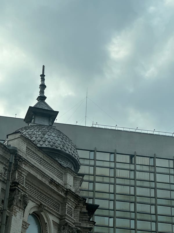 Kyiv street scenes show architectural mix, monocyclist amid traffic