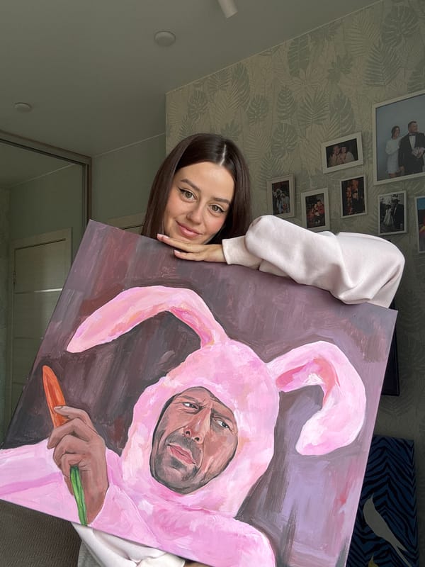 Woman displays quirky bunny painting in Krasnoyarsk apartment selfie session