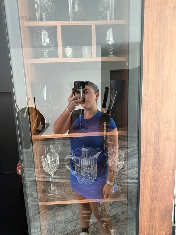 Woman takes mirror selfies in blue outfit, Puebla