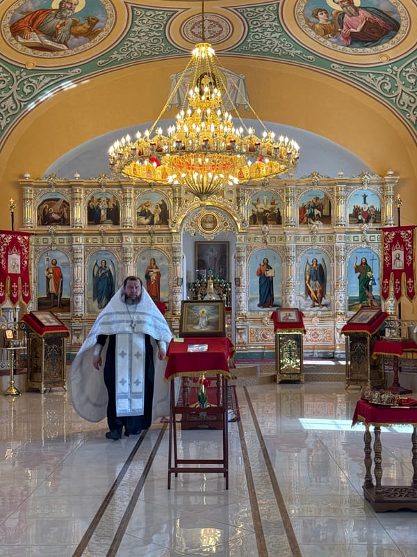 Orthodox wedding ceremony observed in ornate church setting