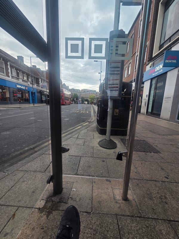 Early morning wait at a London bus shelter