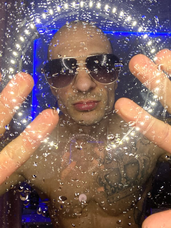 Man Takes Multiple Selfies in LED-Lit Room in Bulgaria
