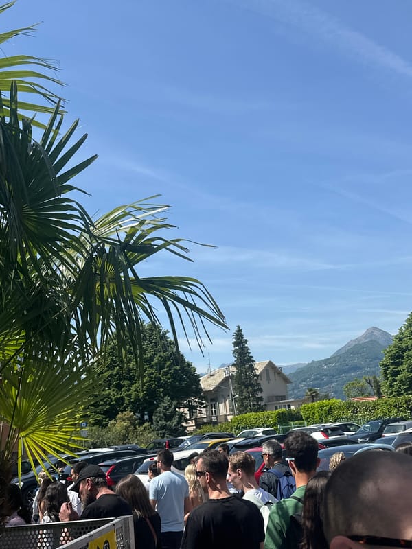 Crowded train platform draws passengers in sunny Gittana, Italy