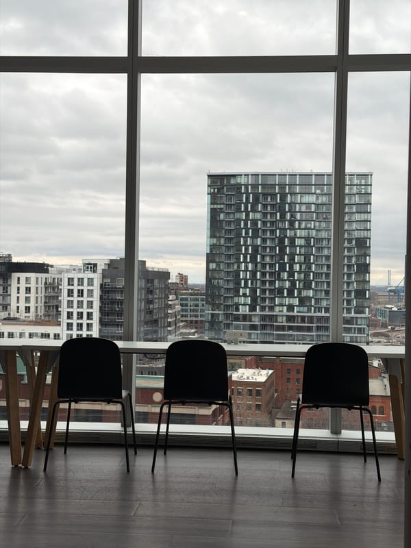 Interior room view with Montreal architecture visible through window