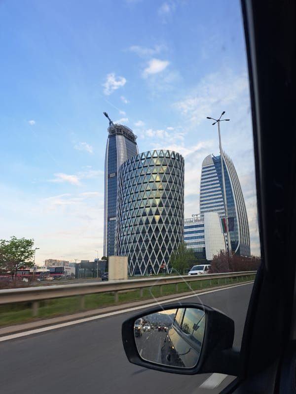Vehicle captures urban skyline views on highway in Bulgaria