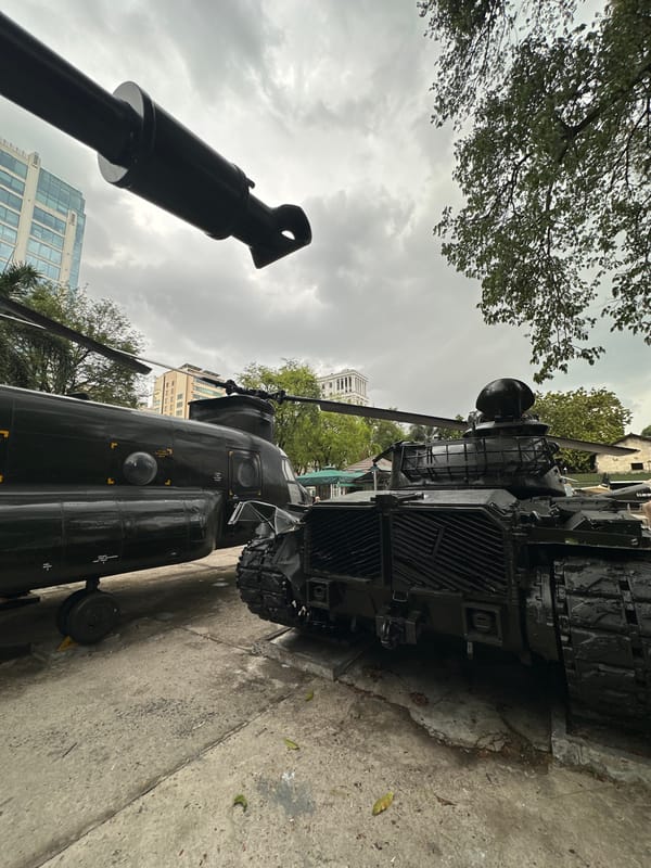 Military vehicles displayed at outdoor museum in Thủ Đức