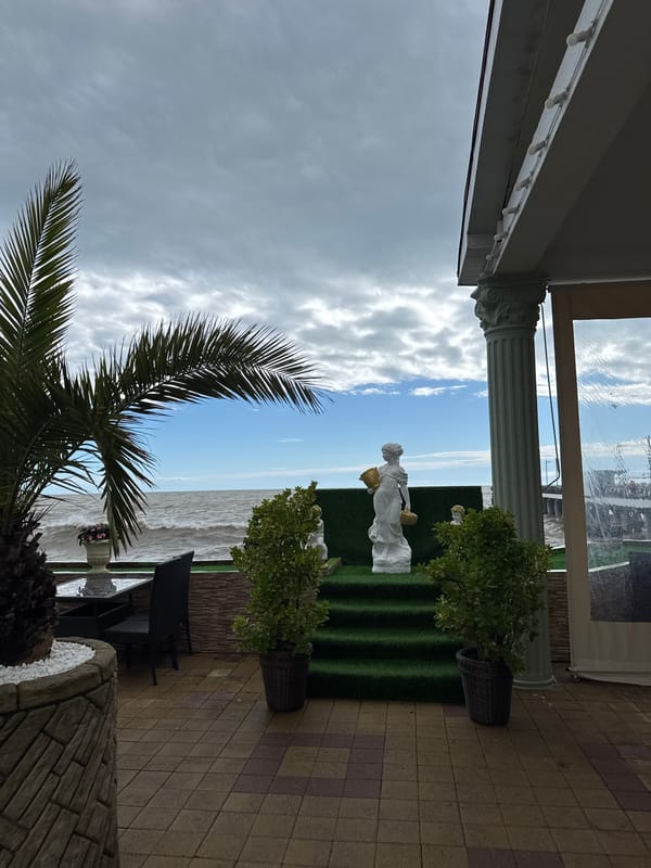 Tourist documents lunch outing at Sochi waterfront and sculptures