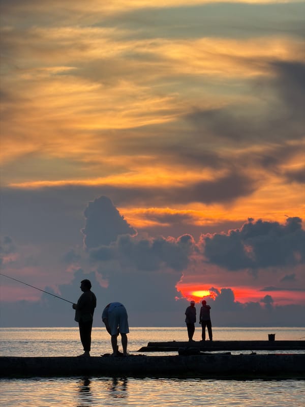 Evening fishing and dog walking at Dederkoy pier sunset