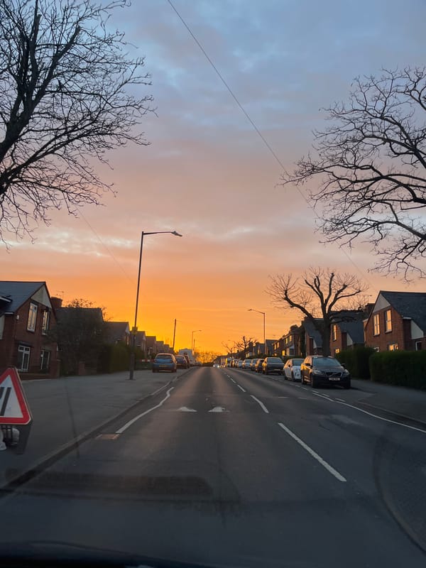 Sunset colors illuminate residential street in Royal Leamington Spa