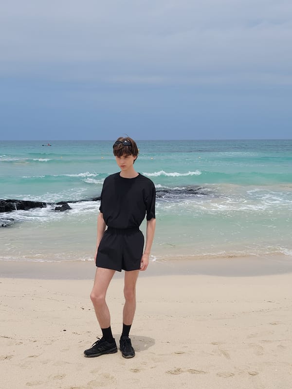 Beachside pause on Jeju's sandy shore