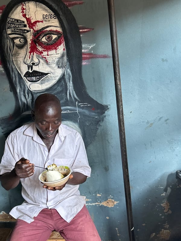 Street scenes outside a mural in Jos, Nigeria